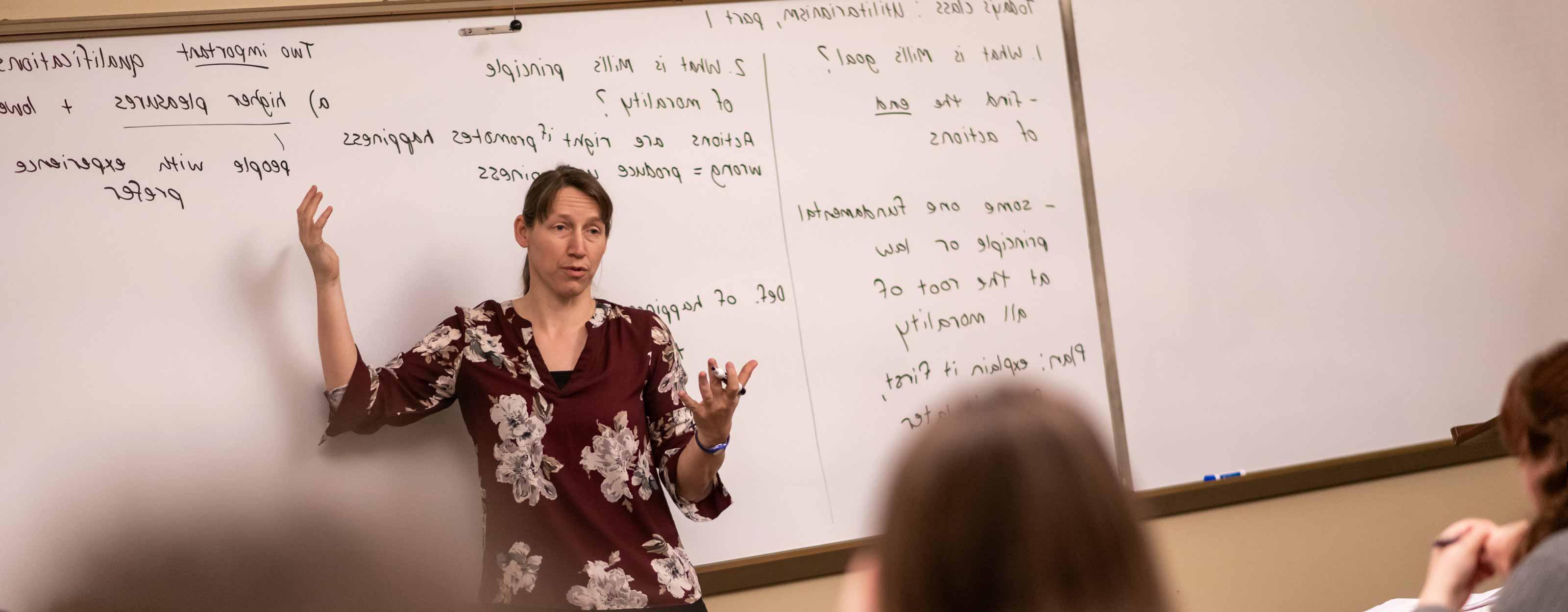 Dr. Jamie Spiering teaches at the whiteboard