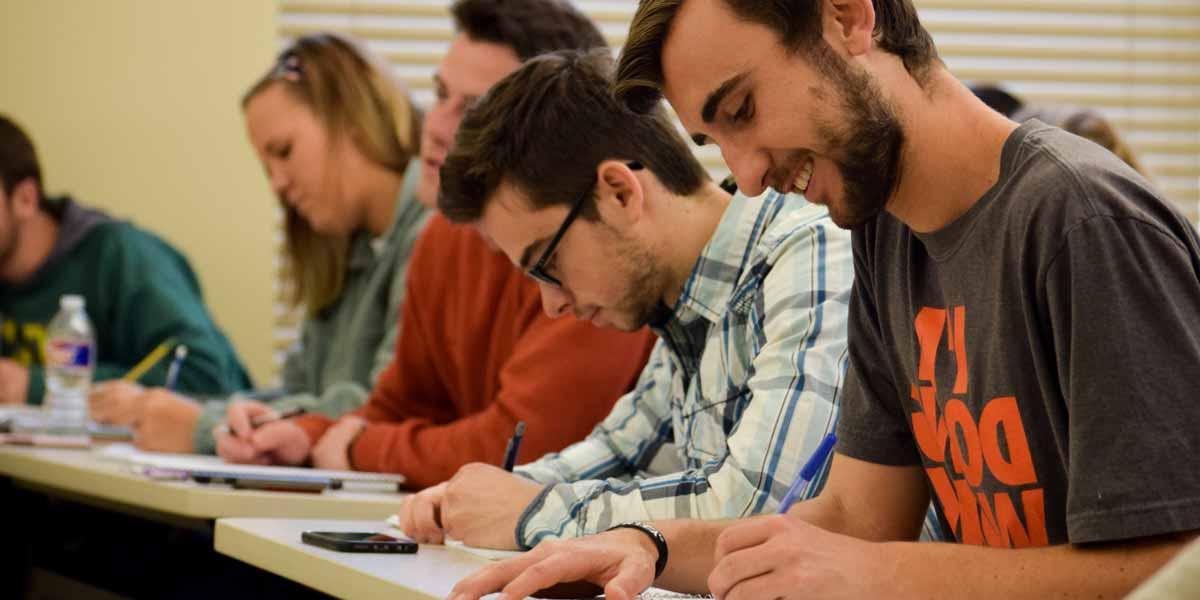 Students take notes in class