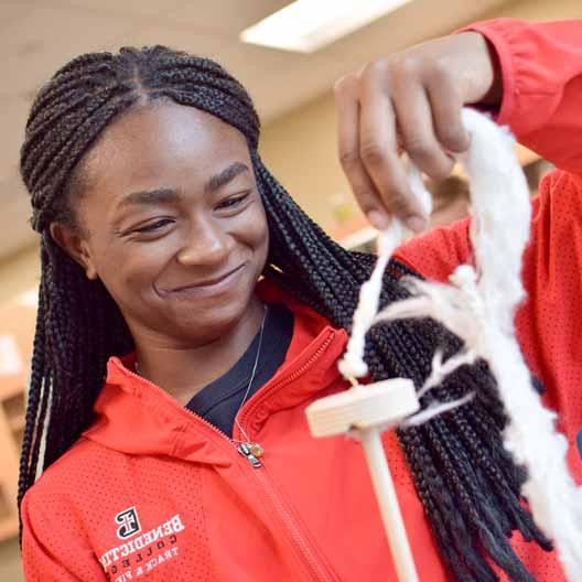 A student works with string in biology class